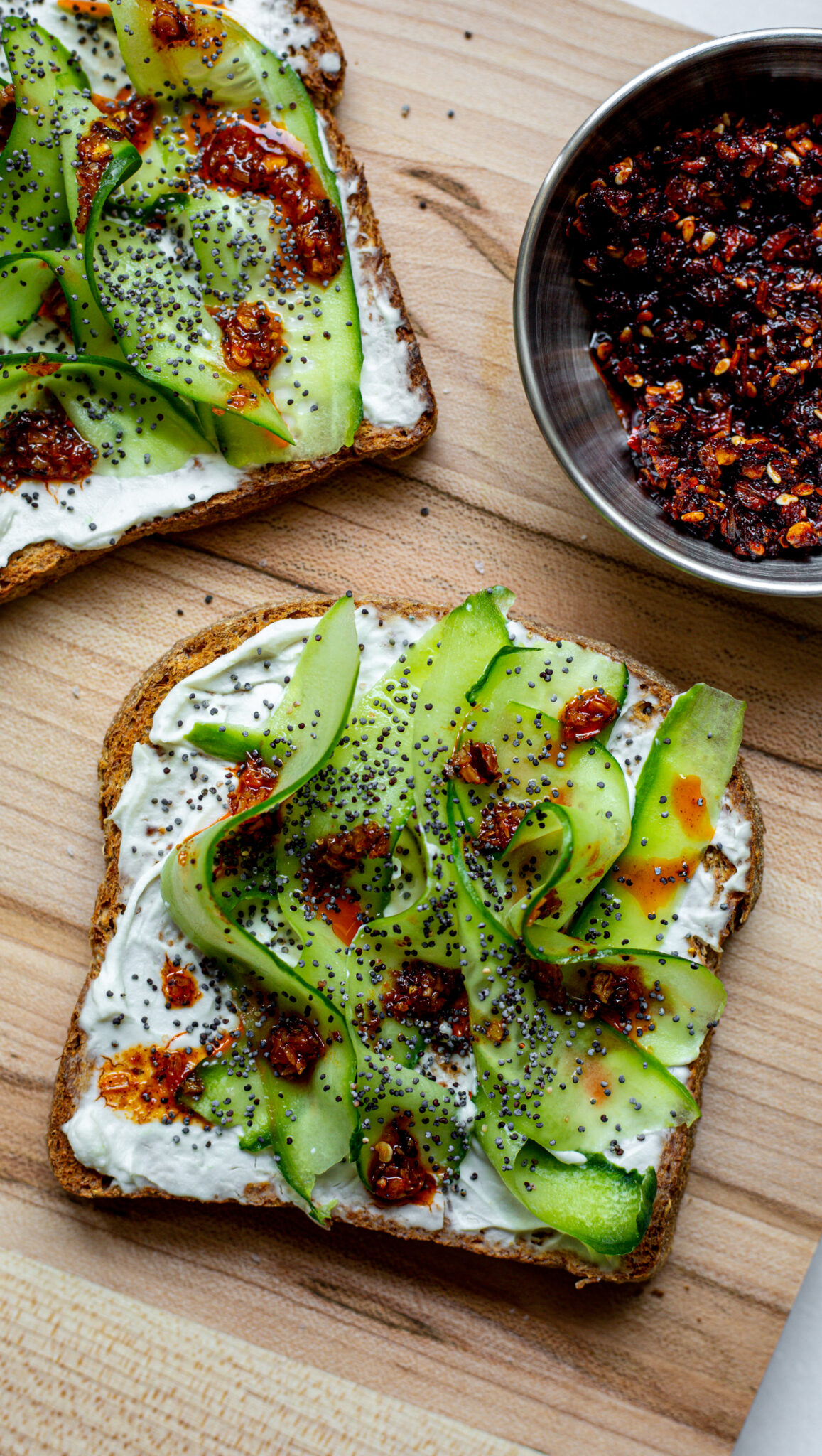 Cucumber Toast with Cream Cheese + Chili Crisp The Plant Collective