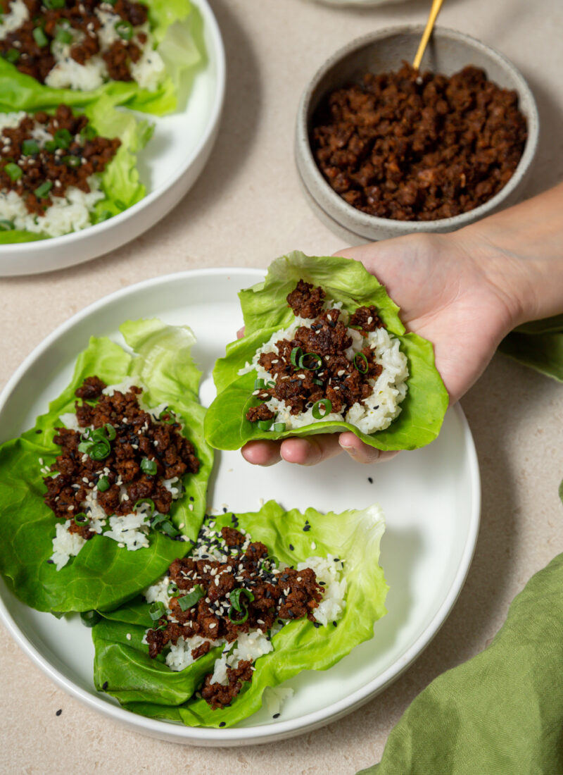 hand holding a beef lettuce cup