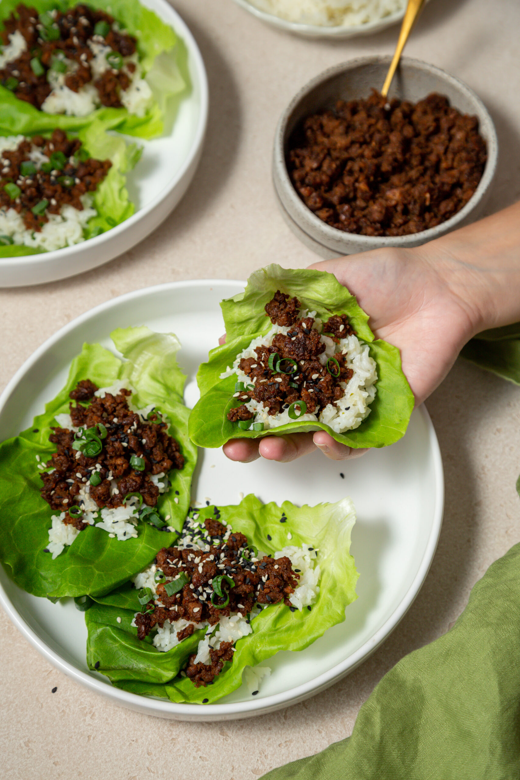 hand holding a beef lettuce cup